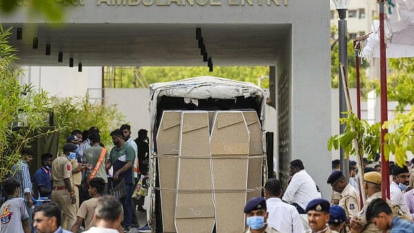 <div class="paragraphs"><p>Coffins arrive at the hospital for victims' bodies to be sent to their families in Ahmedabad's plane crash.</p></div>