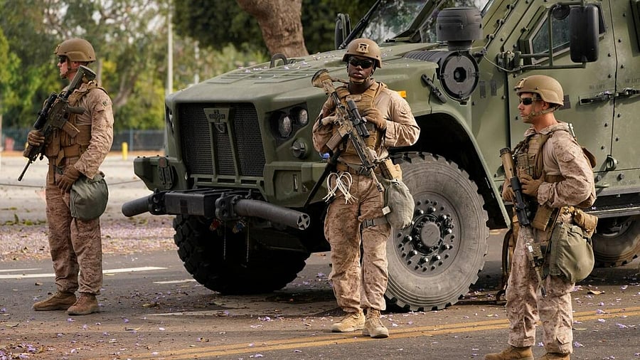 <div class="paragraphs"><p>US Marines stand guard outside the Wilshire Federal Building, after they were deployed to Los Angeles as federal immigration sweeps continue, in Los Angeles, California, US June 13, 2025. </p></div>