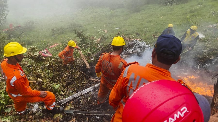 <div class="paragraphs"><p>NDRF personnel at the spot after a helicopter crashed near the Kedarnath shrine, in Rudraprayag district, Uttarakhand</p></div>