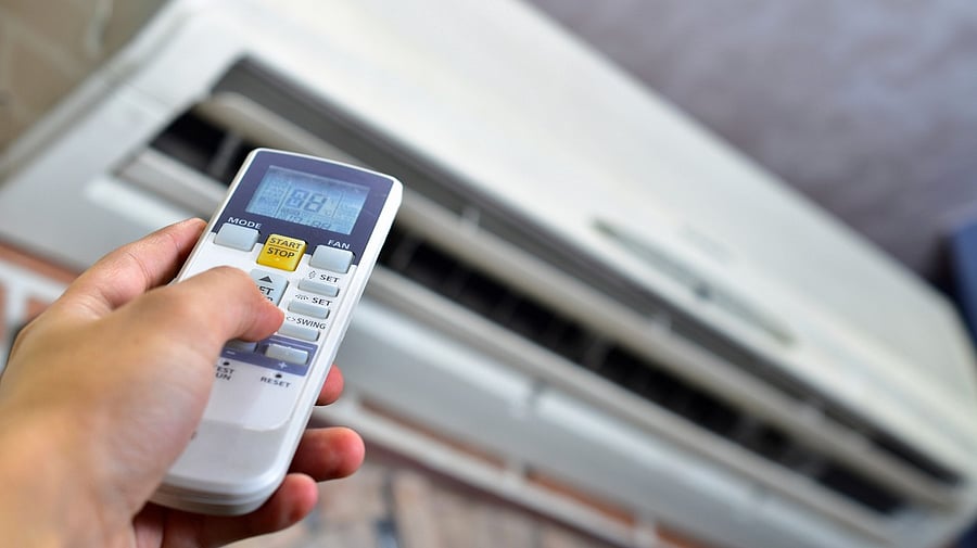 <div class="paragraphs"><p>Image showing a person adjusting temperature settings on their air conditioner. For representational purposes.</p></div>