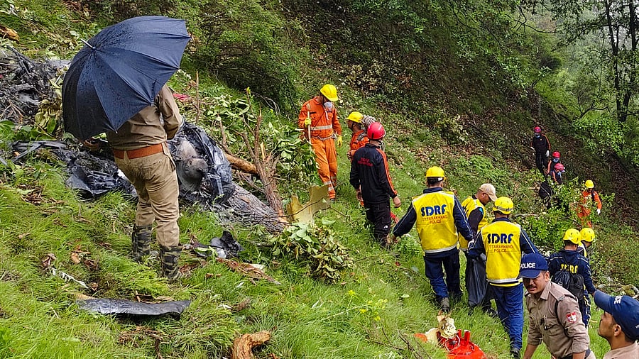 <div class="paragraphs"><p>NDRF and SDRF personnel at the spot after a helicopter crashed near the Kedarnath shrine, in Rudraprayag district, Uttarakhand, Sunday, June 15, 2025.</p></div>