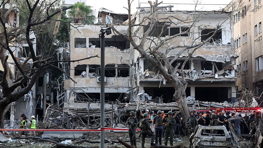<div class="paragraphs"><p>Emergency personnel work at an impact site after missiles were launched from Iran to Israel, in Tel Aviv, Israel, June 16, 2025.</p></div>