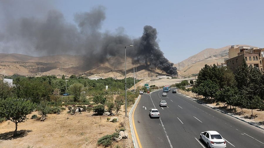 <div class="paragraphs"><p>Smoke rises following what Iran says was an Israeli attack on Sharan Oil depot in Tehran, Iran, June 16, 2025.</p></div>