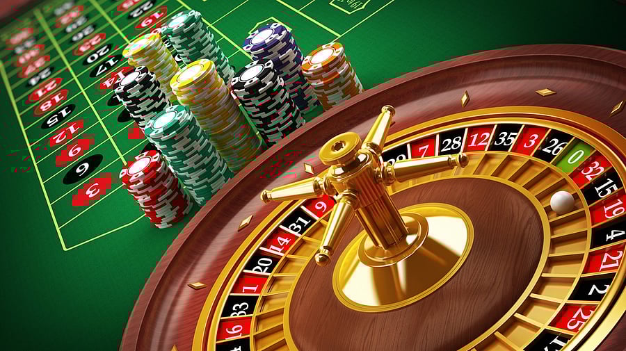 <div class="paragraphs"><p> Illustration showing a Casino roulette wheel with casino chips on green table. Gambling background (Image for representation)</p></div>