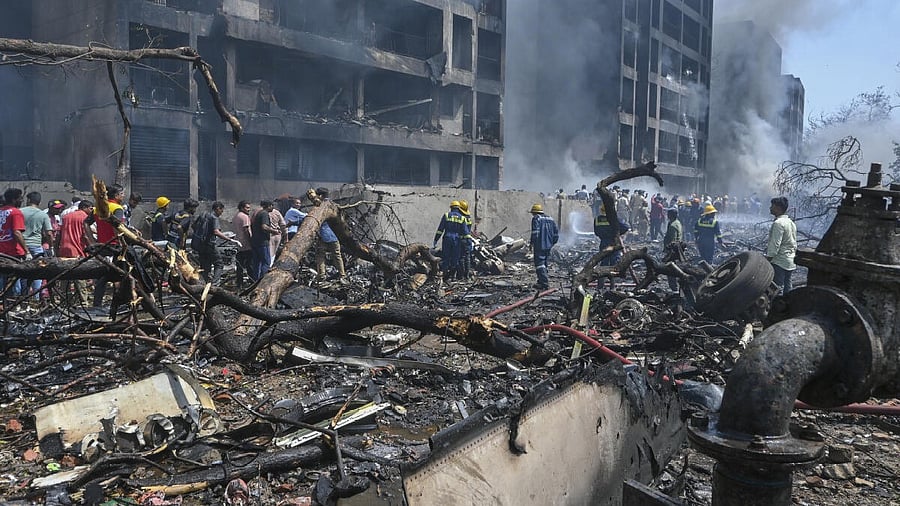 <div class="paragraphs"><p>Fire and Emergency Services personnel at work following the Air India plane crash in Ahmedabad</p></div>