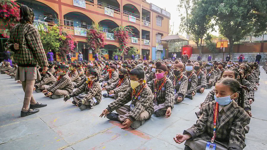 <div class="paragraphs"><p>Students wear face masks during morning assembly.</p></div>