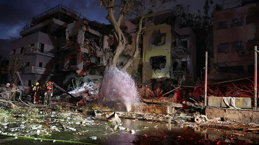 <div class="paragraphs"><p>Emergency personnel operate after missiles were launched from Iran to Israel, in Tel Aviv, Israel, June 16, 2025.</p></div>