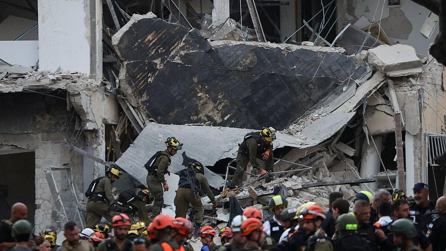 <div class="paragraphs"><p>Emergency personel work at an impact site following a missile attack from Iran on Israel, in Tel Aviv, Israel, June 16, 2025. </p></div>