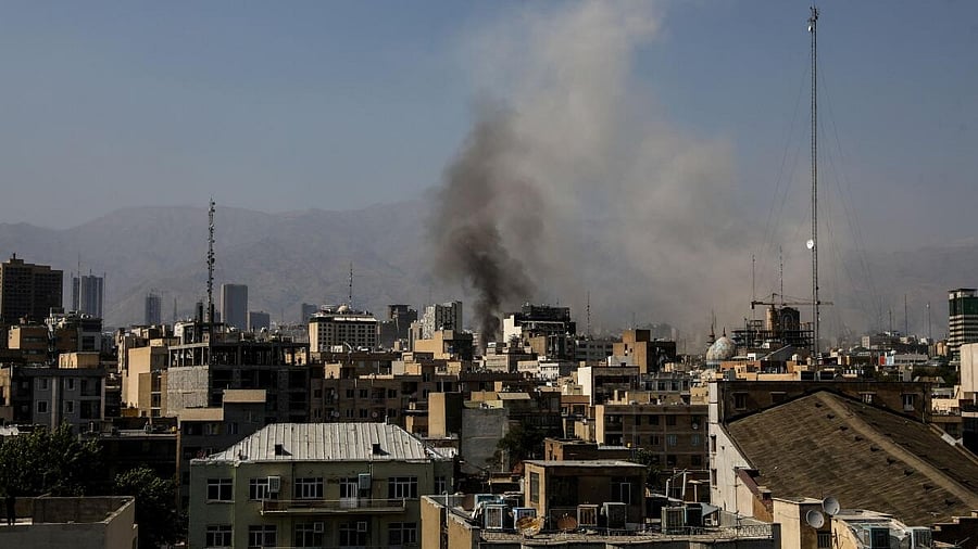 <div class="paragraphs"><p>Smoke rises from an explosion following the Israeli strikes on Iran, in Tehran</p></div>