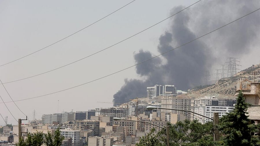 <div class="paragraphs"><p>Smoke rises following attack on Sharan Oil depot in Tehran</p></div>