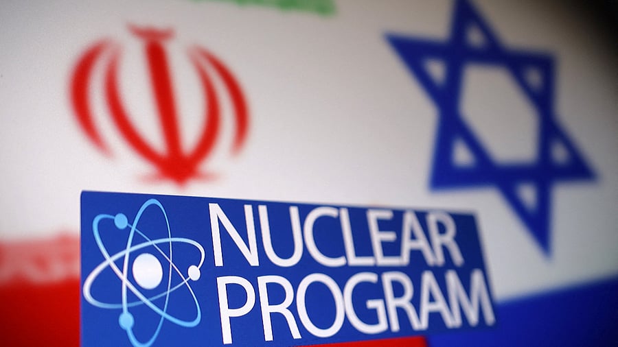 <div class="paragraphs"><p>Iran and Israel flags, atom symbol and words "Nuclear program" are seen in this illustration taken June 16, 2025.</p></div>