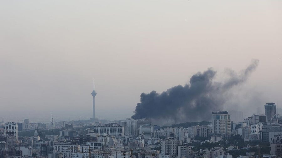 <div class="paragraphs"><p>Smoke rises following an Israeli attack on the IRIB building, the country's state broadcaster, in Tehran</p></div>