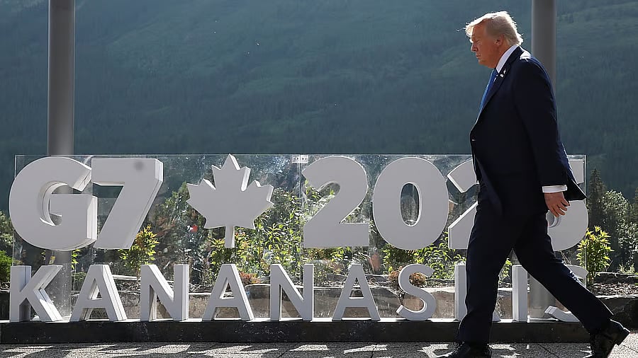 <div class="paragraphs"><p>US President Donald Trump walks to have a family photo taken at the G7 Summit in Kananaskis, Alberta, Canada, June 16, 2025. </p></div>