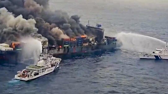 <div class="paragraphs"><p>The Indian Coast Guard ships carry out the firefighting operation after a fire broke out on a Singapore-flagged ship following a container explosion off the Kerala coast</p></div>