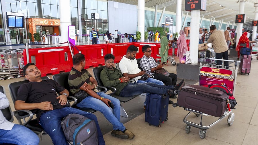 <div class="paragraphs"><p>Passengers wait at Sardar Vallabhbhai Patel International Airport after Air India's flight to London from Ahmedabad was cancelled. </p></div>
