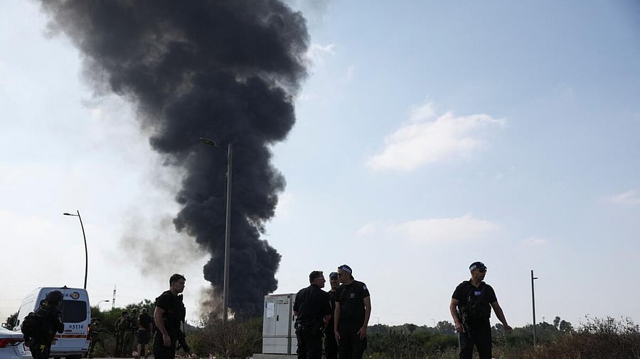 <div class="paragraphs"><p>Emergency personnel work, as smoke rises following a missile attack from Iran, in Herzliya, Israel, June 17, 2025.</p></div>