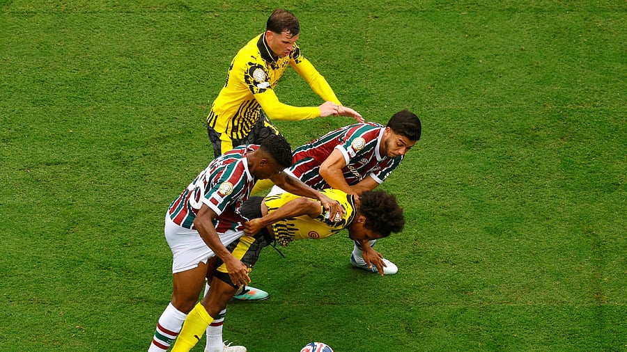<div class="paragraphs"><p> Borussia Dortmund's Pascal Gross and Karim Adeyemi in action against Fluminense's Hercules.</p></div>
