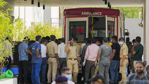 <div class="paragraphs"><p>Ahmedabad: Medics and police personnel outside the mortuary of a hospital, where victims of the Air India plane crash were admitted, in Ahmedabad.&nbsp;</p></div>