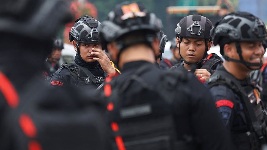 <div class="paragraphs"><p>Riot police officers guard at the capital's governor in Jakarta, Indonesia.</p></div>