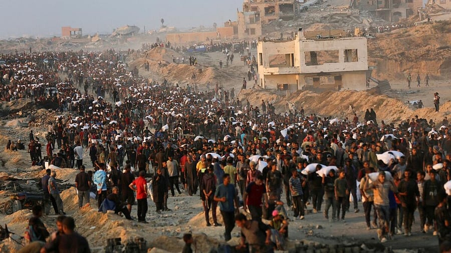 <div class="paragraphs"><p>Palestinians gather to receive aid supplies in Beit Lahia, in the northern Gaza Strip, June 17, 2025.</p></div>