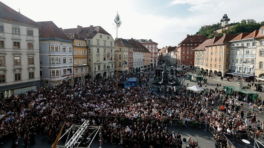 <div class="paragraphs"><p>Victims' relatives join helpers and Graz community members for a last coming together on the main square after three days of state mourning ended following a school shooting, in Graz, Austria, June 15, 2025.</p></div>