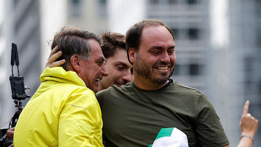 <div class="paragraphs"><p>Former Brazilian President Jair Bolsonaro is greeted by his son Carlos Bolsonaro at a demonstration against Jair Bolsonaro's judicial process and to demand the amnesty of all accused of taking part in the alleged conspiracy to overthrow the government, in Sao Paulo, Brazil.</p></div>