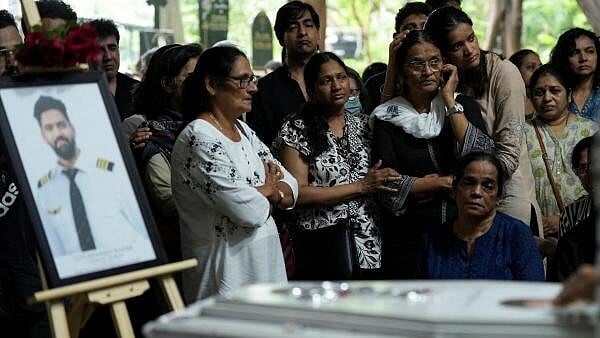<div class="paragraphs"><p>Friends and family members mourn near the coffin of Co-Pilot Clive Kunder, who died after an AIR India Boeing 787-8 Dreamliner plane crashed during take-off from  Ahmedabad airport.</p></div>