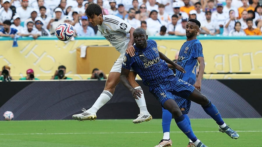 <div class="paragraphs"><p>Real Madrid's Gonzalo Garcia heads at goal.</p></div>