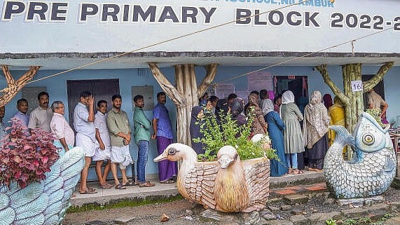 <div class="paragraphs"><p>People wait in a queue to cast their votes during the Nilambur Assembly by-election, at GMLP School, in Malappuram district.&nbsp;</p></div>