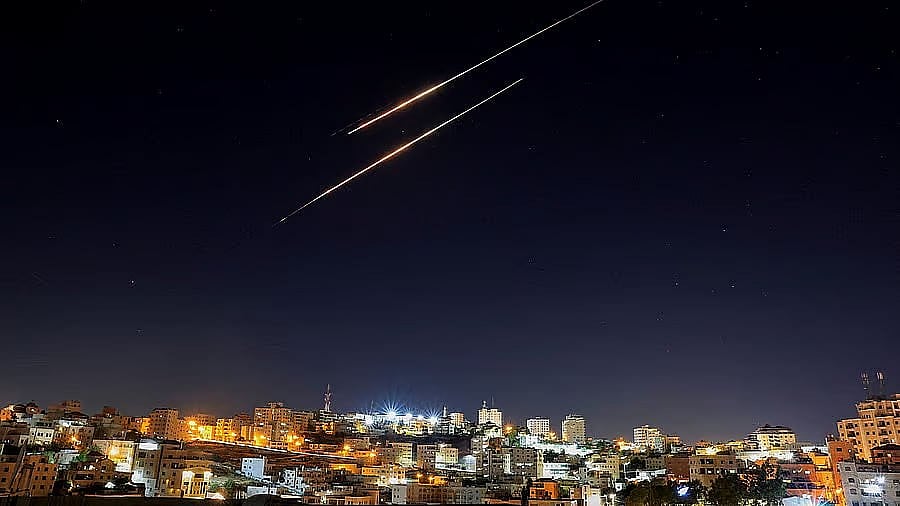 <div class="paragraphs"><p>Missiles launched from Iran towards Israel are seen from Hebron, in the Israeli-occupied West Bank.</p></div>