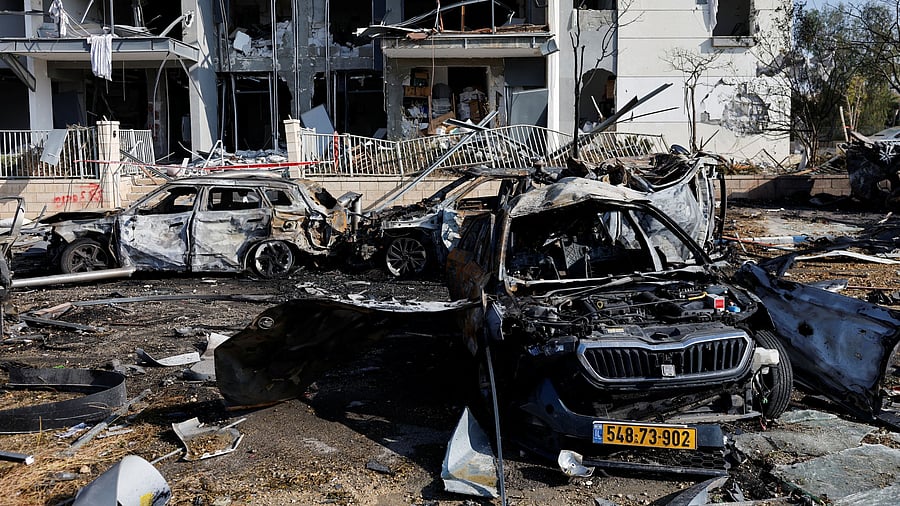 <div class="paragraphs"><p>A view of burnt cars and a damaged building at an impact site following Iran's missile strike on Israel, in Be'er Sheva, Israel, June 20, 2025.</p></div>