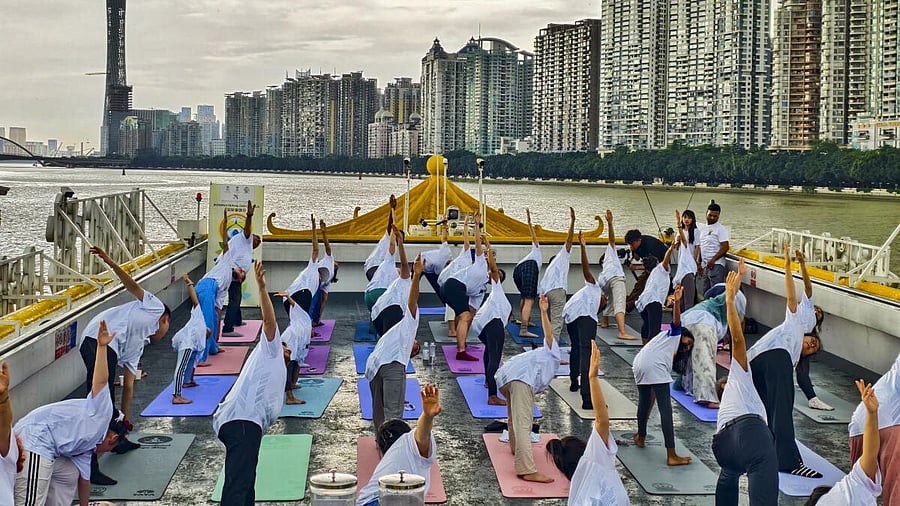 <div class="paragraphs"><p>People perform yoga on the International Day of Yoga, in Guangzhou, China.</p></div>