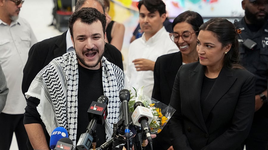 <div class="paragraphs"><p>Columbia University graduate student Mahmoud Khalil speaks to the press next to U.S. Rep. Alexandria Ocasio-Cortez  at Newark airport, a day after being released from immigration custody, in Newark, New Jersey, U.S., June 21, 2025. </p></div>