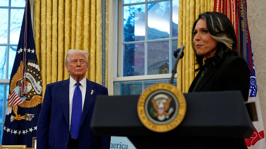 <div class="paragraphs"><p>US President Donald Trump looks at Director of National Intelligence Tulsi Gabbard.</p></div>