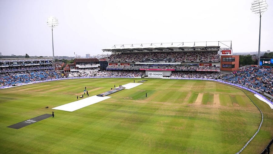 <div class="paragraphs"><p> General view of covers on the field as play gets delayed due to rain.</p></div>