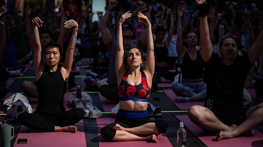 <div class="paragraphs"><p>Yogis participate in a yoga class during the 23rd annual "Solstice in Times Square: Mind Over Madness Yoga" event to celebrate the summer solstice in New York City, US, June 20, 2025.</p></div>