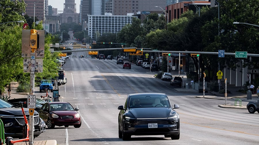 <div class="paragraphs"><p>A Tesla robotaxi drives on the street along South Congress Avenue in Austin, Texas</p></div>