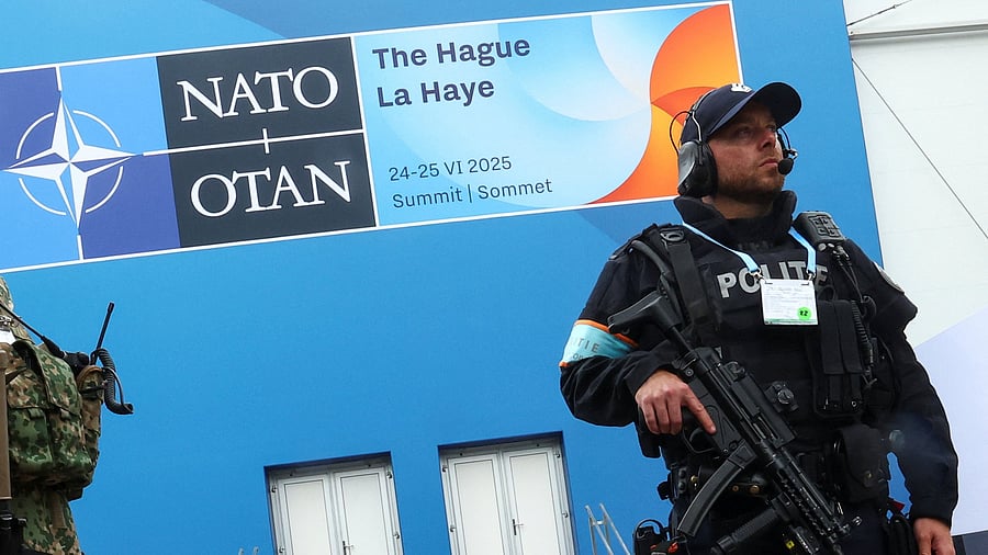 <div class="paragraphs"><p>A member of Police guards the security perimeter ahead of a NATO leaders' summit in The Hague, Netherlands.</p></div>