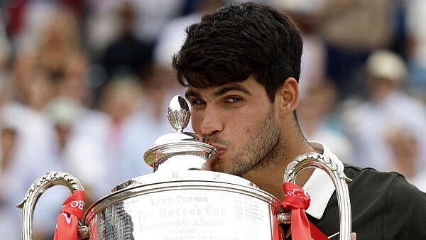 <div class="paragraphs"><p>Spain's Carlos Alcaraz celebrates with the trophy after winning his final against Czech Republic's Jiri Lehecka.</p></div>