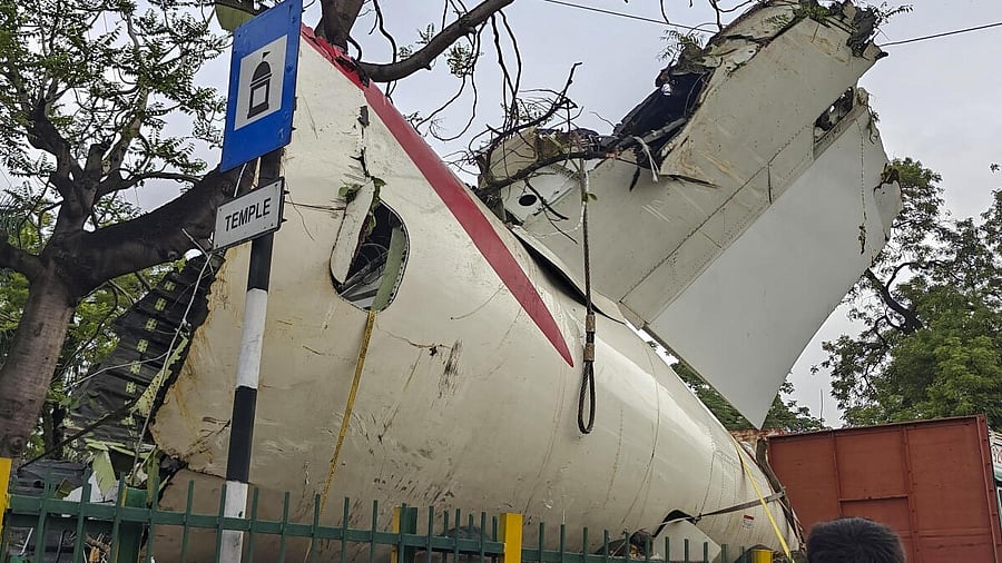 <div class="paragraphs"><p>A truck carrying wreckage of the Air India plane that recently crashed into a medical hostel and its canteen complex passes by, in Ahmedabad</p></div>