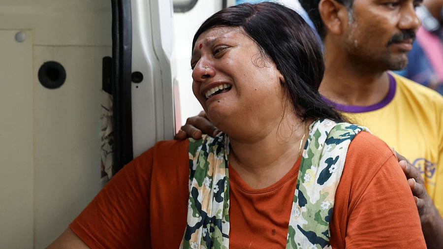 <div class="paragraphs"><p>A woman reacts after receiving the body of a victim who died when an Air India Boeing 787-8 Dreamliner plane crashed during take-off from an airport, at Civil Hospital in Ahmedabad</p></div>