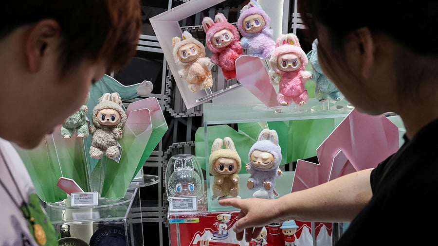 <div class="paragraphs"><p>People look at Labubu dolls at the flagship store of Pop Mart in Shanghai, China.</p></div>