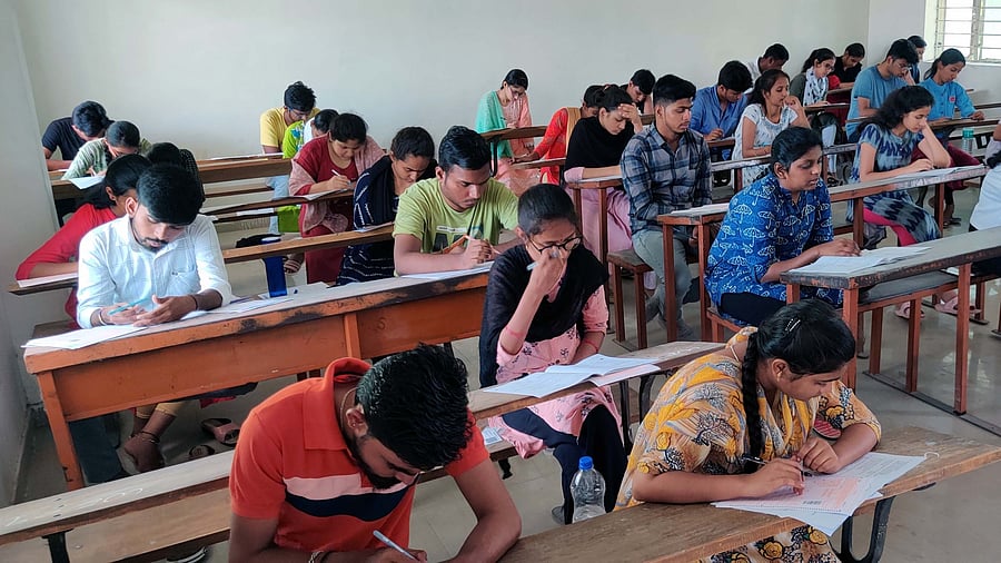 <div class="paragraphs"><p>Students in Karnataka taking exam</p></div>