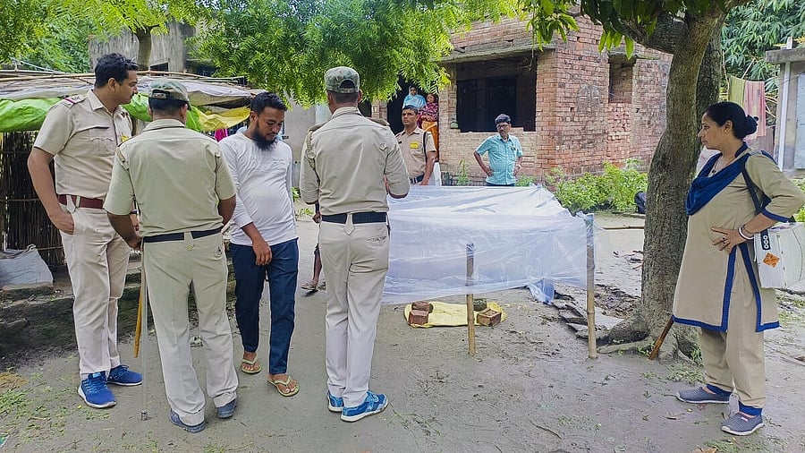 <div class="paragraphs"><p>Police personnel conduct investigation at the site after a nine-year-old girl was killed in a bomb explosion in Kaliganj, in West Bengal's Nadia district, Monday, June 23, 2025.</p></div>