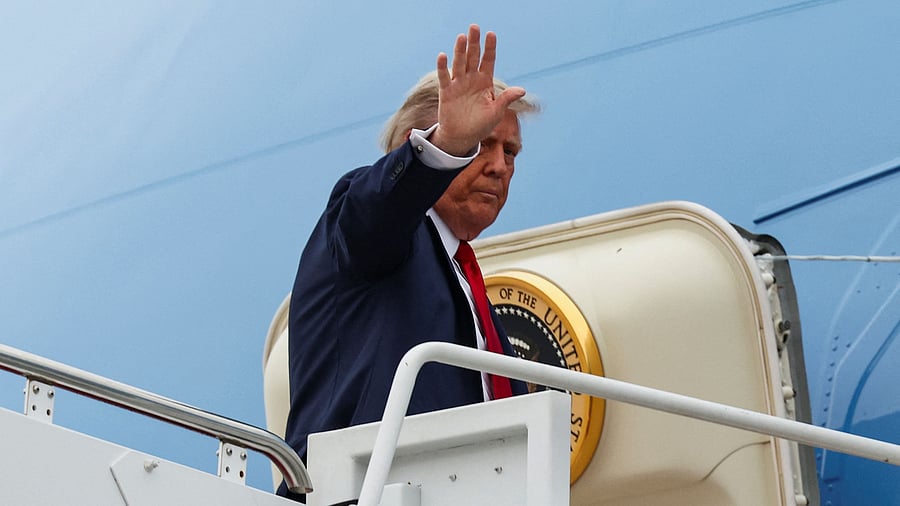 <div class="paragraphs"><p>US President Donald Trump waves while boarding Air Force One.</p></div>