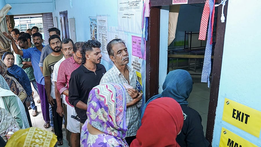 <div class="paragraphs"><p>People wait in a queue to cast their votes during the Nilambur Assembly by-election</p></div>