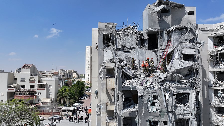 <div class="paragraphs"><p>A drone view shows emergency personnel working at an impacted residential site, following an early morning missile attack from Iran on Israel, in Be'er Sheva, Israel June 24, 2025.</p></div>