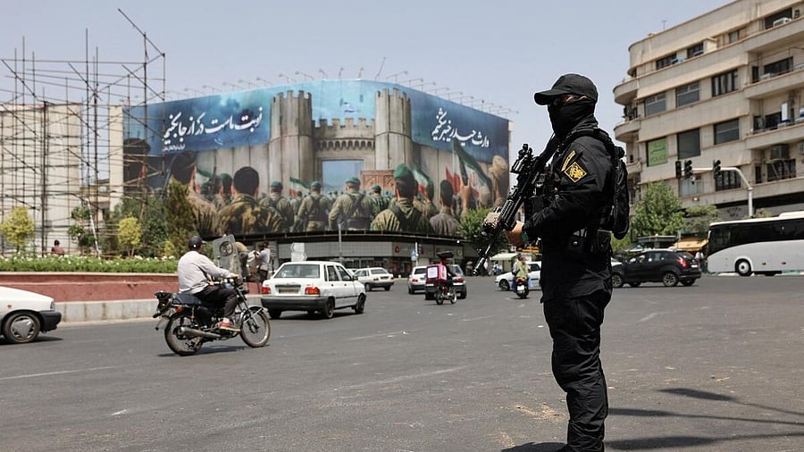 <div class="paragraphs"><p>A security guard stands on a street, during early hours of ceasefire, in Tehran, Iran, June 24, 2025. </p></div>