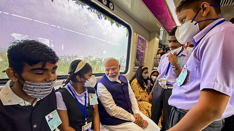 <div class="paragraphs"><p>Prime Minister Narendra Modi interacts with students as he travels with them in the Pune Metro after inaugurating it.</p></div>