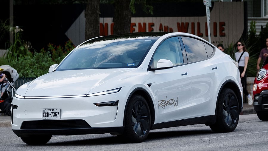 <div class="paragraphs"><p>A Tesla robotaxi drives on the street along South Congress Avenue in Austin, Texas</p></div>